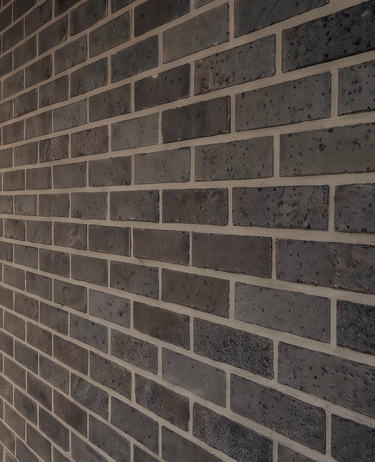 Rendering of a wall of long grey brick in low sun